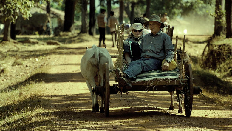 tourists riding a bullock cart